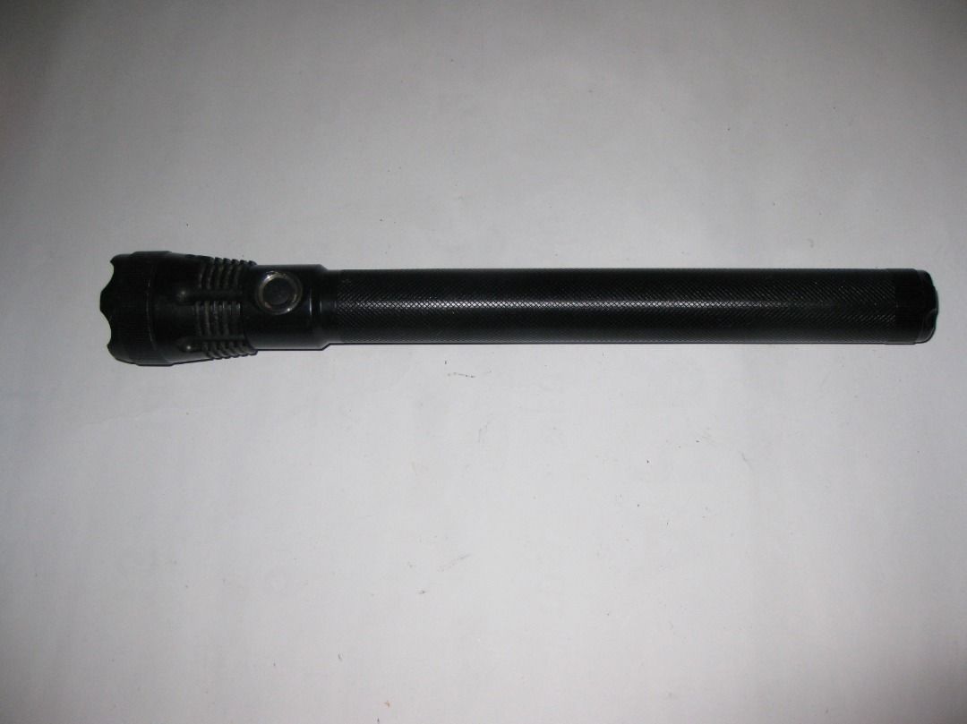 Black UltraFire UF-5C Baton Tactical Flashlight (Category: Hiking & Camping) located in Baguio. Submitted by winstonsheebamonna (Listing ID 1444533318, Image 1). Description: This is an UltraFire UF-5C Tactical Baton Flashlight featuring an adjustable zoom function to switch between flood and spot lighting. The torch is constructed from durable black aluminum alloy, designed to be shock-resistant for rugged use. This is hard to find model that wa