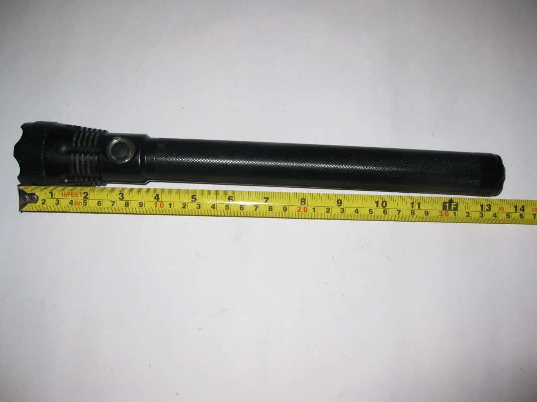 Black UltraFire UF-5C Baton Tactical Flashlight (Category: Hiking & Camping) located in Baguio. Submitted by winstonsheebamonna (Listing ID 1444533318, Image 3). Description: This is an UltraFire UF-5C Tactical Baton Flashlight featuring an adjustable zoom function to switch between flood and spot lighting. The torch is constructed from durable black aluminum alloy, designed to be shock-resistant for rugged use. This is hard to find model that wa