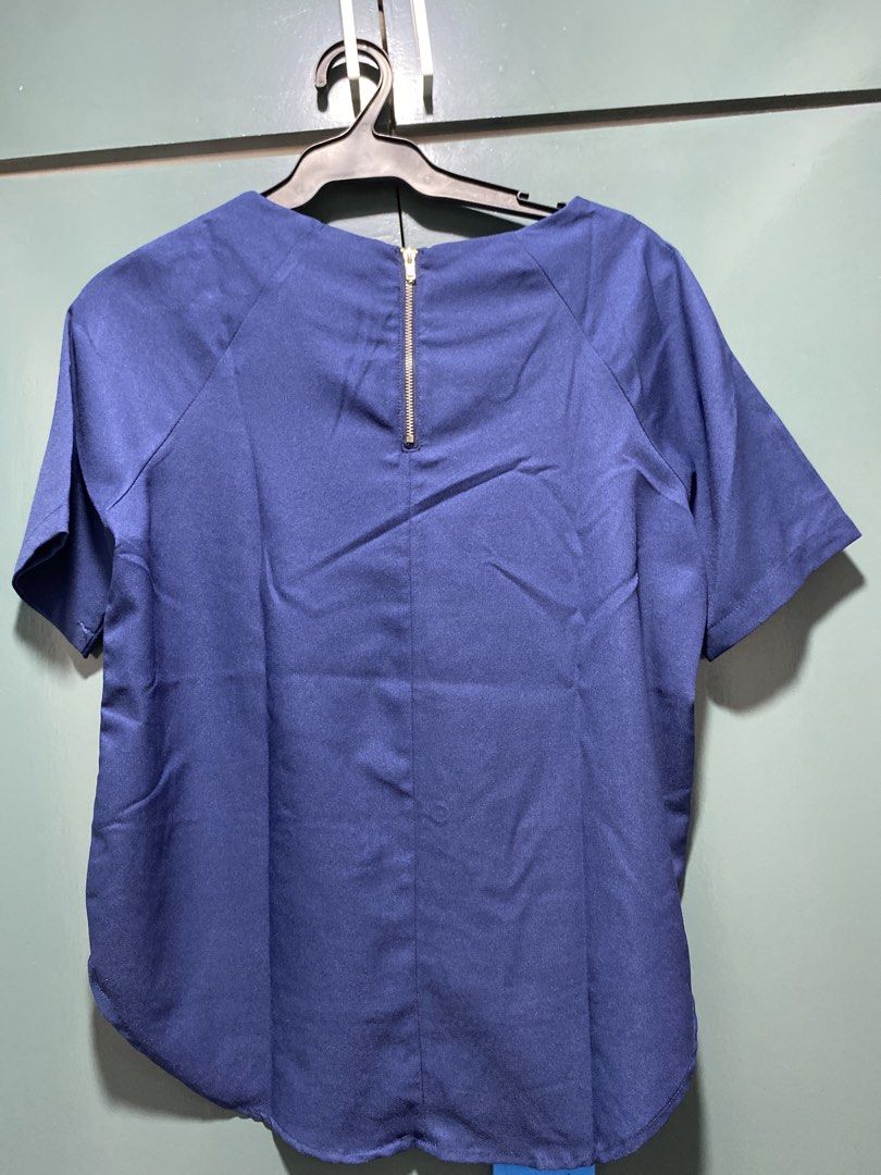 Blue Short Sleeve Top with Zipper Back (Category: Blouses) located in Manila. Submitted by brlovet (Listing ID 1444633384, Image 2). Description: - Simple blue top - Zipper closure at the back - Curved hemline, longer at the back - Ideal for casual wear.