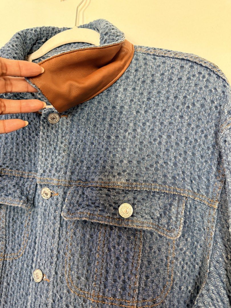 Blue Textured Denim Jacket with Brown Leather Collar (Category: Coats, Jackets and Outerwear) located in Quezon City. Submitted by yourheaduhunter (Listing ID 1444562031, Image 2). Description: - Classic blue denim jacket - Unique textured fabric all over - Brown faux leather collar detail - Button-up front with chest pockets - Great for layering or wearing solo - Essential wardrobe staple.