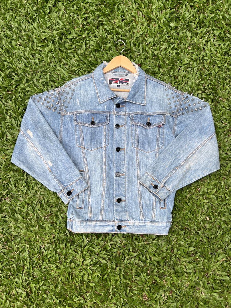 BLUES HEROES SPIKE DENIM JACKET (UNISEX) (Category: Coats, Jackets and Outerwear) located in Solano. Submitted by aljoners (Listing ID 1444573251, Image 1). Description: Size: S Width: 21.5 Length: 25.5 Color rate: 10/10 Condition: 10/10 Issue/s: 2 missing spike but unnoticeable and minimal rust stain but unnoticeable “Color may vary due to lighting”.