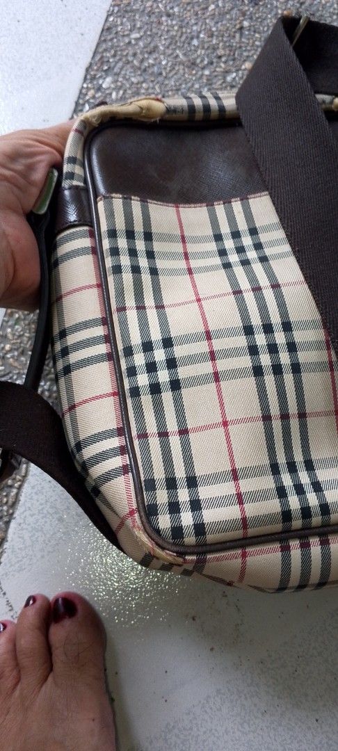 Burberry Nova Check Crossbody Bag (Category: Luxury Bags & Wallets) located in Caloocan City. Submitted by nobleflower_4c42cc (Listing ID 1444560090, Image 3). Description: - Classic Burberry crossbody bag - Iconic Nova Check pattern - Genuine leather trim and strap - Interior zippered pocket - Perfect for everyday use - Shows some signs of wear on leather trim and corne authentic but may flaws.