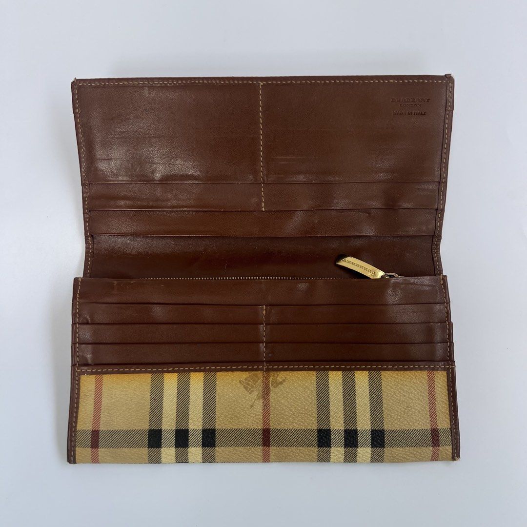 Burberry Vintage Nova Check Continental Wallet (Category: Luxury Bags & Wallets) located in Iloilo. Submitted by errrr0r (Listing ID 1444509548, Image 2). Description: features: • classic beige nova check coated canvas • brown leather trim and interior • long continental-style flap wallet • multiple card slots • interior zip compartment read!!! • can be cleaned or washed using wipes or any soft towel/brush • has a small hole on the outer right pa