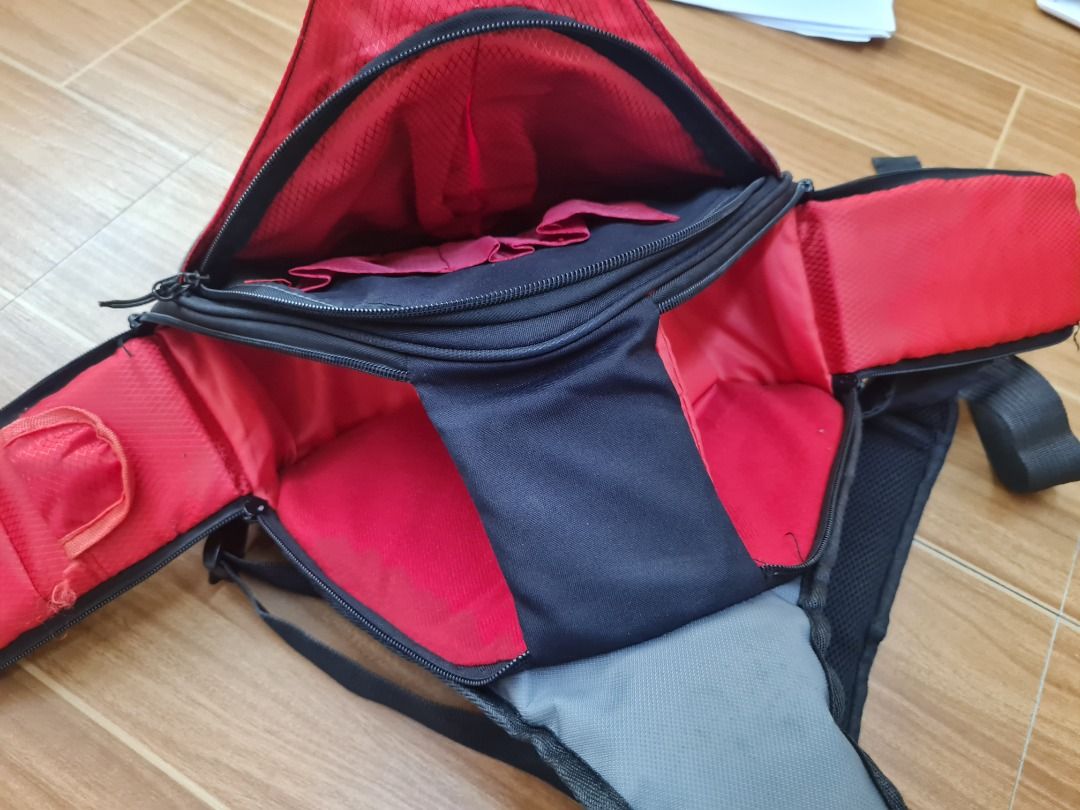 CANON Camera Bag, Sling Bag, Carrying Case (Category: Camera Bags & Carriers) located in Davao. Submitted by hiihenloo (Listing ID 1444611064, Image 3). Description: - Grey and red Canon sling bag - Good padding - Adjustable Internal Divider - Multiple internal compartments for camera gear - Adjustable strap with buckle closure - Ideal for carrying camera and accessories Actual View of the Item: https://drive.google.com/drive/folders/1fv_7-_sRLUD