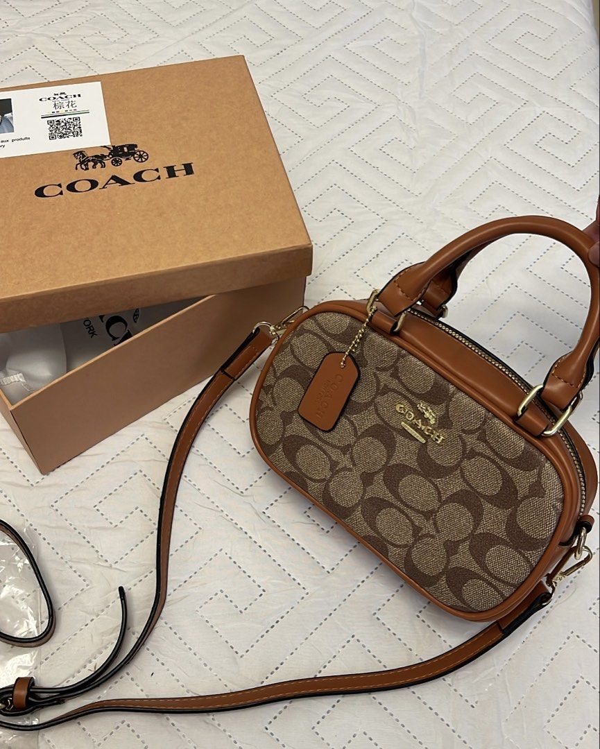 Coach Monogram Canvas Leather Trim Barrel Bag (Category: Luxury Bags & Wallets) located in Binan City. Submitted by machatto.declutter (Listing ID 1444636376, Image 2). Description: complete inclusion w box, sling, and dust bag 💌.