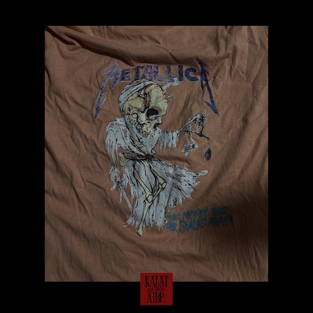 Cotton On Metallica Graphic Tee Size M (Category: Shirts) located in Mabalacat. Submitted by tindahaniblue (Listing ID 1444546613, Image 3). Description: - Orange Cotton On t-shirt - Features a cool Metallica graphic print - Classic fit - Size: Medium (M) - Made in Bangladesh - Shows some signs of wear, but still in good usable condition - Ideal for any Metallica fan.
