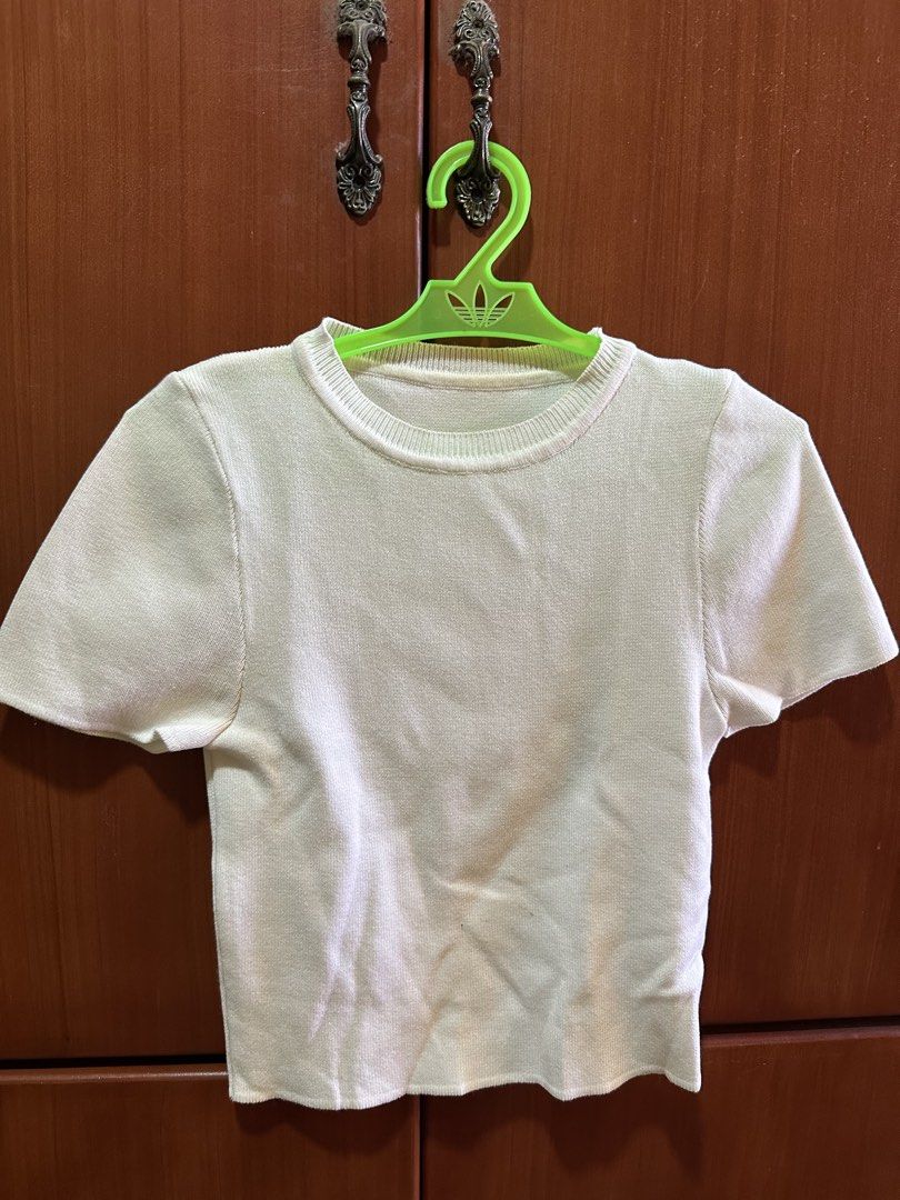Cream Knit Cropped T-shirt (Category: Shirts) located in Dasmarinas. Submitted by maecybee (Listing ID 1444533657, Image 1). Description: - Cream knit cropped t-shirt - Short sleeves - Round neckline - Subtle textured fabric - Comfortable for everyday wear - Easy to pair with high-waisted bottoms - Ideal for casual outings.