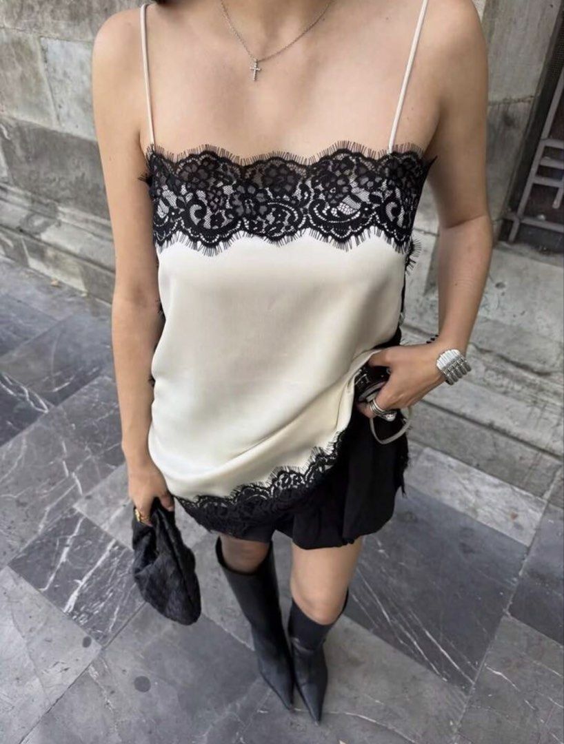 Cream Lace Trim Camisole Top (Category: Sleeveless) located in Manila. Submitted by aishcz (Listing ID 1444513714, Image 2). Description: - Cream camisole top - Black lace trim detail - Silky material feel - Spaghetti straps - Loose, comfortable fit RFS. Declutter.