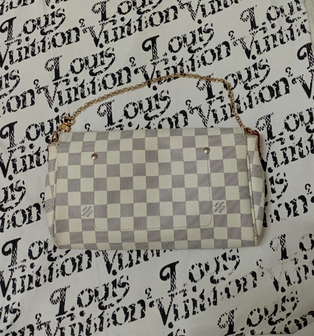 Damier Azur Canvas Clutch / Pochette (Category: Luxury Bags & Wallets) located in Manila. Submitted by eriiicaspage (Listing ID 1444596501, Image 2). Description: PreOWNED Lightly Used ,WellUsed Damier Azur Canvas Pochette Clutch / Shoulder bag Magnetic Snap Flap Closure - Gold Chain Strap - Interior Slip Pocket Coded 🩶🤍 Not guaranteed if Real / Authentic - Clean Interior and Exterior - Ideal for Essentials Sign of Used Flaws : Rubs on hardware