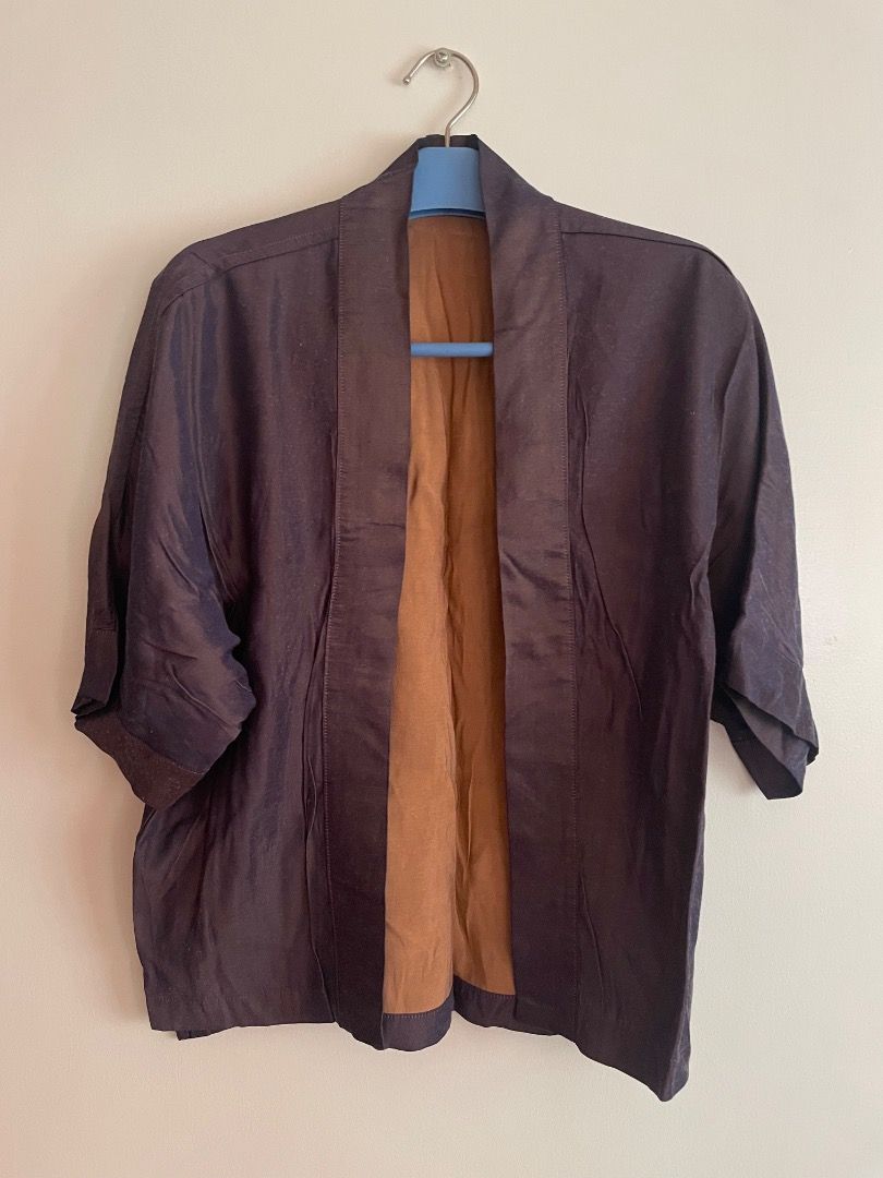 Dark Purple Kimono Style cover up (Category: Coats, Jackets and Outerwear) located in Paranaque City. Submitted by cngaya (Listing ID 1444573370, Image 2). Description: - Elegant purple/pink cover up with a unique kimono-inspired cut. - Features a shantung fabric where you can see the purple and pink kinda shifting through depending on the light - Stylish three-quarter length sleeves. - Fabric boasts a subtle sheen and texture, adding a touch of 
