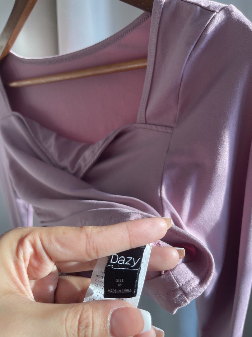 Dazy Long Sleeve Square Neck Ruched Crop Top M (Category: Blouses) located in Batangas. Submitted by declutter.meowma (Listing ID 1444587024, Image 2). Description: - Brand: Dazy - Style: Long sleeve crop top - Neckline: Square - Details: Ruched sides with tie details - Estimated Size: Medium (M) - Color: Soft mauve / dusty rose - Versatile: Great for layering or wearing on its own - Features: Comfortable and stylish.