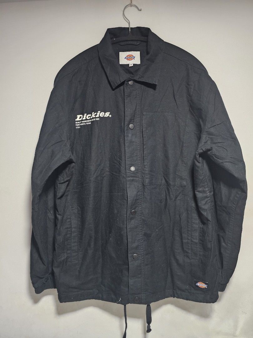 Dickies Black Workwear Jacket Size M (Category: Coats, Jackets and Outerwear) located in Manila. Submitted by thrift_archive (Listing ID 1444652398, Image 1). Description: - Classic black Dickies work jacket - Iconic Dickies logo on the chest - Easy snap button closure - Adjustable drawstring hem for a custom fit - embodying quality workwear since 1922 - Size: Medium (M) dimes 23.5w x 29L.