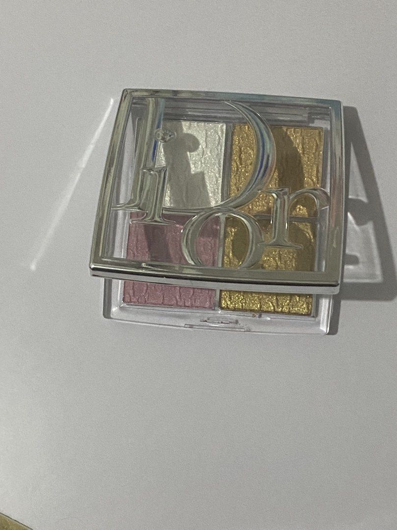 Dior Highlighter Palette - 001 USED (Category: Makeup) located in Del Monte. Submitted by pageturner_digital (Listing ID 1444651320, Image 1). Description: - Authentic Dior highlighter palette - Features stunning pink and gold shades - Elegant case with embossed Dior logo - Compact and travel-friendly design - Ideal for creating versatile makeup looks - Used only the white the rest are still new..