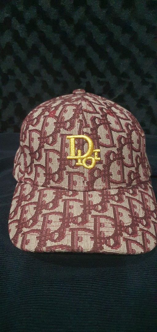Dior Monogram Baseball Cap (Category: Caps & Hats) located in Manila. Submitted by jonardbare73149 (Listing ID 1444533308, Image 1). Description: - Classic Dior monogram cap - Features iconic all-over Dior print - Gold 'CD' logo detail on the front - Adjustable strap at the back for a customized fit - Perfect for casual and everyday wear.