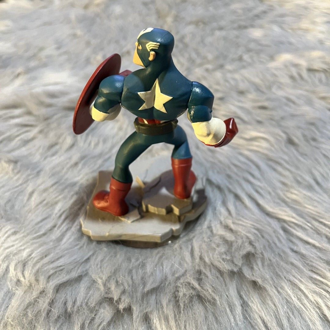 Disney Infinity Captain America Figure (Category: Figurines & Statues) located in Manila. Submitted by declutterfairy_ph (Listing ID 1444508742, Image 2). Description: Figure has minor dents but still in good condition. 8/10.