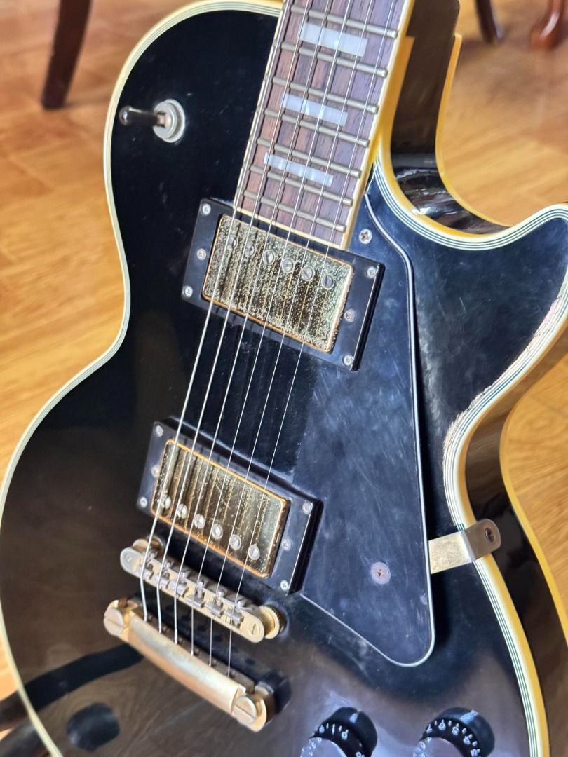 Epiphone Les Paul Custom Electric Guitar - Black (Category: Musical Instruments) located in Caloocan City. Submitted by mightywater_71bc75 (Listing ID 1444510635, Image 2). Description: - Black Epiphone Les Paul Custom electric guitar - Hardware oxidizing - great player guitar - Good fret life - Signs of use - Headstock finish chip repaired.