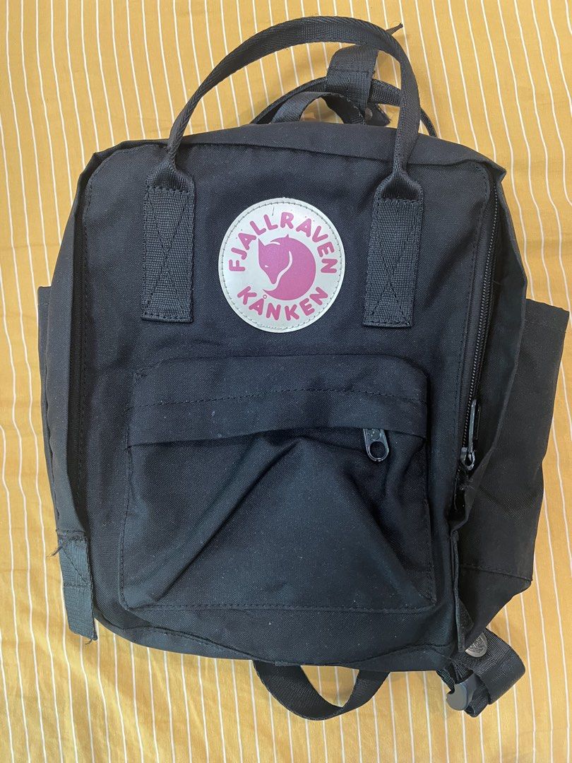 Fjallraven Kanken Mini Black Backpack (Category: Diaper Bags & Wetbags) located in Bay. Submitted by charlenesy (Listing ID 1444577546, Image 2). Description: -Authentic -Only one zipper is working yet can secure the bag - Stitches ripped on the inside (minimal) .