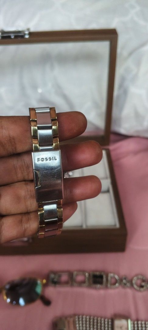 Fossil Two-Tone Watch with Crystal Bezel (Category: Women's Watches) located in Dasmarinas. Submitted by MVB0505 (Listing ID 1444511655, Image 3). Description: - Fossil Two-Tone Stainless Steel Watch - Band: Silver and Gold finish - Dial: White with crystal accents around the bezel - Display: Classic analog with number markers - Closure: Secure clasp - Style: Elegant and versatile, ideal for everyday wear..complete stone.