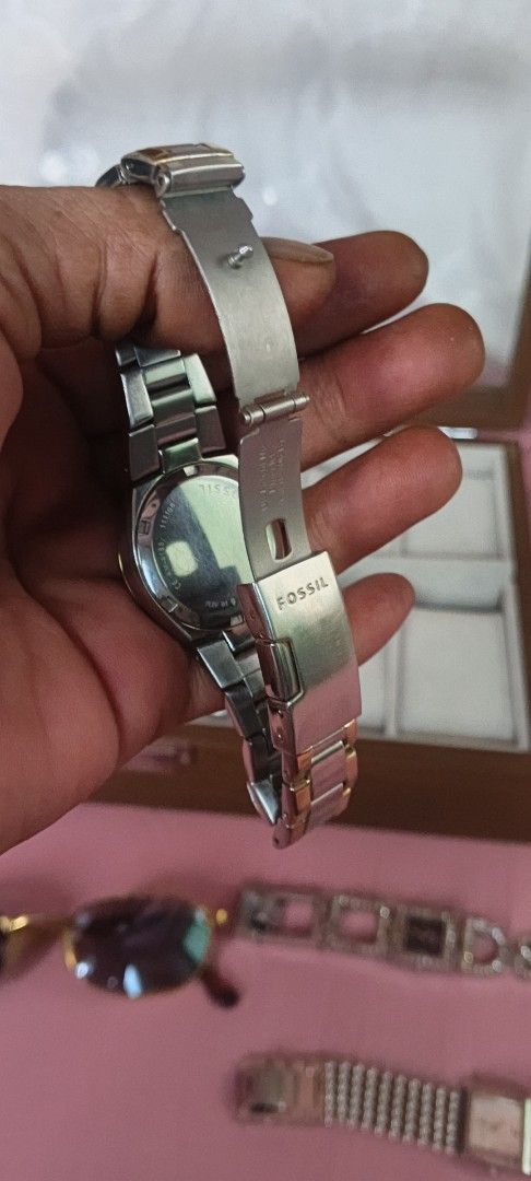 Fossil Two-Tone Watch with Crystal Bezel (Category: Women's Watches) located in Dasmarinas. Submitted by MVB0505 (Listing ID 1444511655, Image 2). Description: - Fossil Two-Tone Stainless Steel Watch - Band: Silver and Gold finish - Dial: White with crystal accents around the bezel - Display: Classic analog with number markers - Closure: Secure clasp - Style: Elegant and versatile, ideal for everyday wear..complete stone.