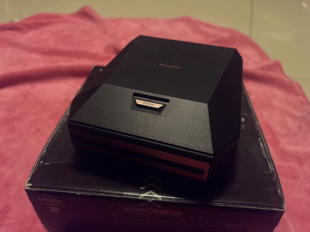 Fujifilm Instax Share SP-3 Printer (Category: Printers, Scanners & Copiers) located in Manila. Submitted by zxxvie (Listing ID 1444644298, Image 3). Description: hi, selling my old Instax sp3 printer! only used once and in a very good condition 🩷 price is still negotiable! - Fujifilm Instax Share SP-3 Printer (Black) - Includes original packaging and charger. - Wirelessly prints photos directly from your smartphone - User-friendly operation - Pe