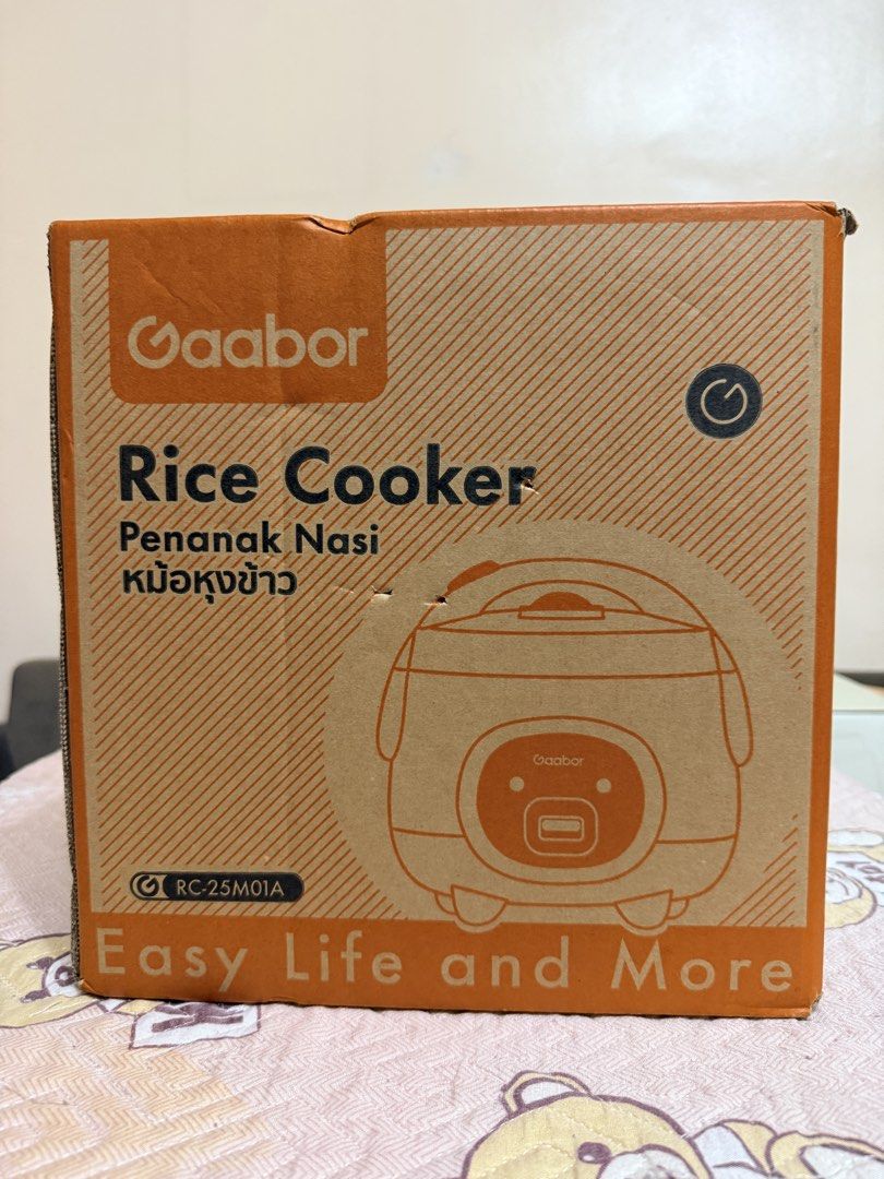 Gaabor Rice Cooker RC-25M01A 2.0L (Category: Cookers) located in Las Pinas. Submitted by happyluv0302 (Listing ID 1444541267, Image 1). Description: - Gaabor Rice Cooker Model: RC-25M01A - Capacity: 2.0 Liters (ideal for small families or individuals) - Power: 400W - Frequency: 50-60Hz - Includes: Rice paddle - Lightweight and compact design.