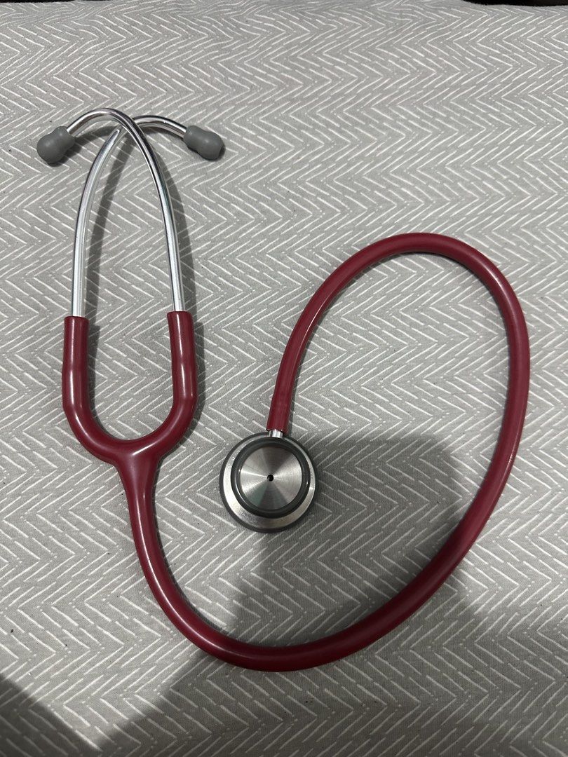 German Quality Stethoscope - Burgundy (Category: Medical Supplies & Tools) located in Mandaluyong City. Submitted by josa_xox0i8 (Listing ID 1444657897, Image 2). Description: - Burgundy stethoscope with 'German Quality' printed on the chestpiece. - Deep red tubing for a stylish look. - Comfortable grey ear tips. - Ideal for medical students and healthcare professionals. - Feel free to ask any questions!.