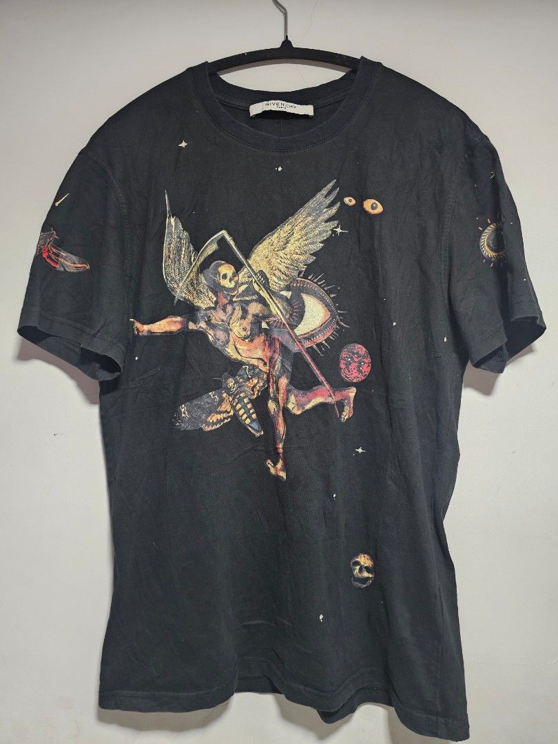 Givenchy Paris Black Graphic T-Shirt (Category: Tshirts & Polo Shirts ) located in Manila. Submitted by thrift_archive (Listing ID 1444648736, Image 1). Description: - Authentic Black Givenchy Paris T-shirt - Unique graphic print featuring celestial and mythological imagery - Perfect addition to any fashion collection - dimes 21w x29L issue cut wash tag .