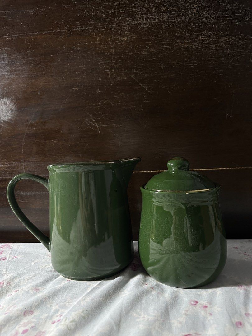 Green Ceramic Pitcher and Sugar Bowl Set (Category: Other Kitchenware & Tableware) located in Marikina City. Submitted by _mlcg (Listing ID 1444602829, Image 1). Description: - Set includes a green ceramic pitcher and a matching sugar bowl with lid - Deodorant for size comparison RFS: funding my cats' FIP medication.