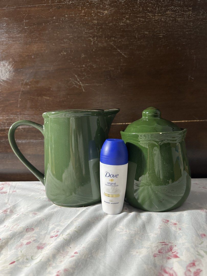Green Ceramic Pitcher and Sugar Bowl Set (Category: Other Kitchenware & Tableware) located in Marikina City. Submitted by _mlcg (Listing ID 1444602829, Image 2). Description: - Set includes a green ceramic pitcher and a matching sugar bowl with lid - Deodorant for size comparison RFS: funding my cats' FIP medication.
