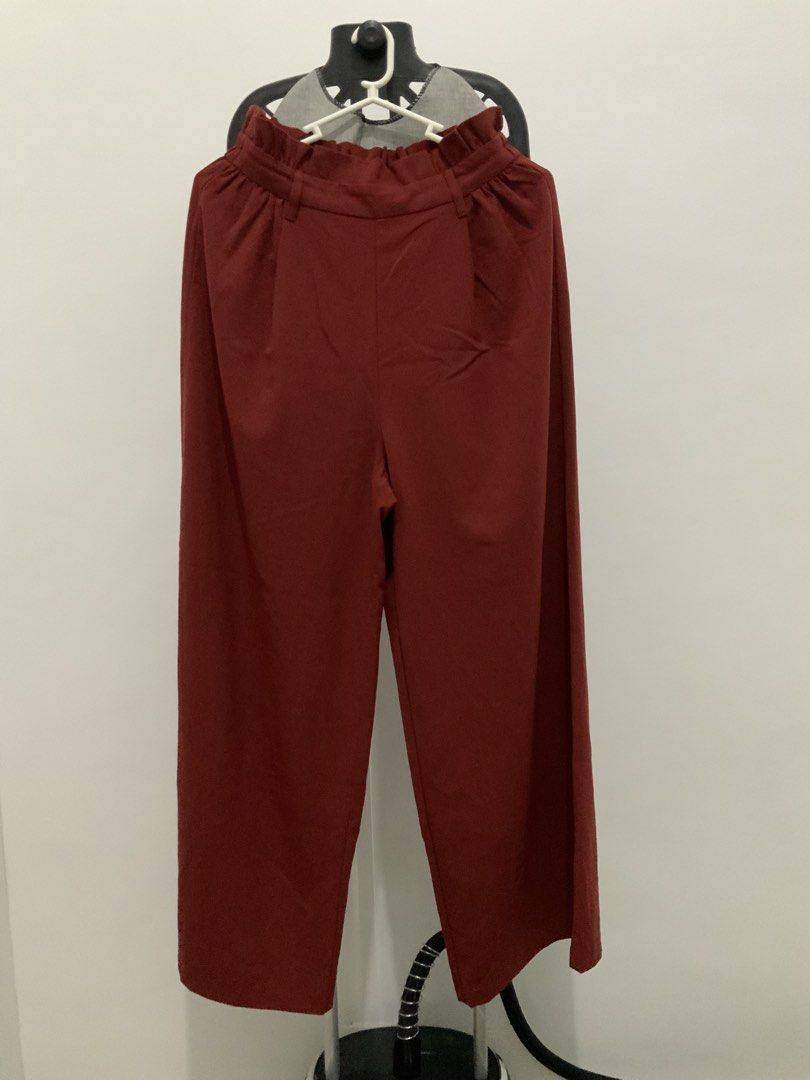 GU Wide Leg Pants - Red Color (Category: Other Bottoms) located in Taguig. Submitted by mstyphoon (Listing ID 1444535459, Image 2). Description: - Red colored wide leg pants from GU - Elastic waistband with ruffled detail - Cropped length - Made from a comfortable polyester blend - Perfect for stylish everyday wear - Versatile and easy to pair with various tops.