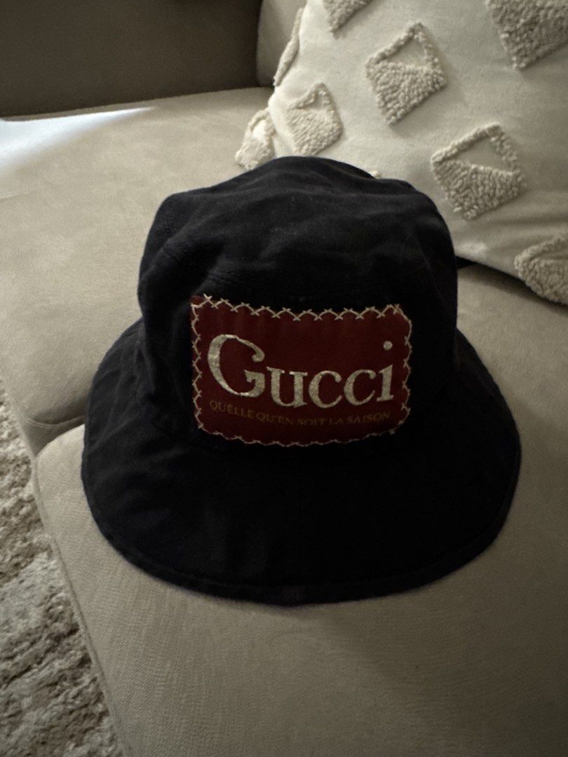 Gucci Black Bucket Hat Size L 59cm (Category: Hats & Beanies) located in Taguig. Submitted by byebyebabies (Listing ID 1444554676, Image 1). Description: - Authentic Gucci Bucket Hat - Made in Italy - Size: L (fits 59cm) - Features classic Gucci logo patch - Ideal for sunny days and completing your look.