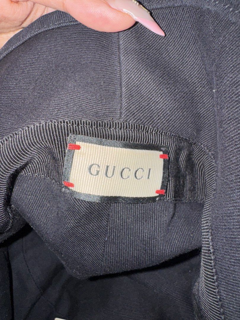 Gucci Black Bucket Hat Size L 59cm (Category: Hats & Beanies) located in Taguig. Submitted by byebyebabies (Listing ID 1444554676, Image 2). Description: - Authentic Gucci Bucket Hat - Made in Italy - Size: L (fits 59cm) - Features classic Gucci logo patch - Ideal for sunny days and completing your look.