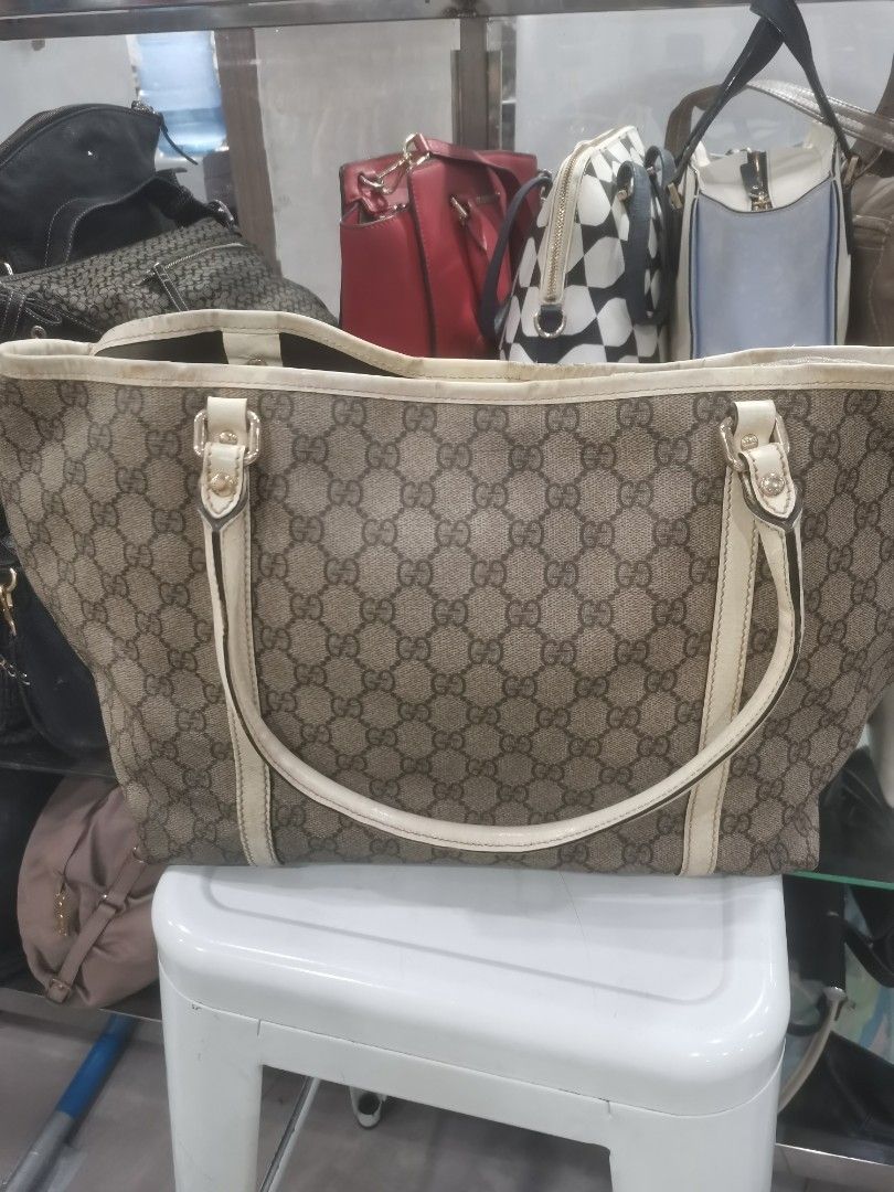 Gucci GG Monogram Tote Bag Beige/Cream (Category: Luxury Bags & Wallets) located in Manila. Submitted by mrpalkups666 (Listing ID 1444636618, Image 2). Description: - Gucci tote bag - Classic GG monogram canvas - Cream leather trim - Spacious interior, perfect for everyday or travel - Interior is clean - Serial number visible in photos - Made in Italy.
