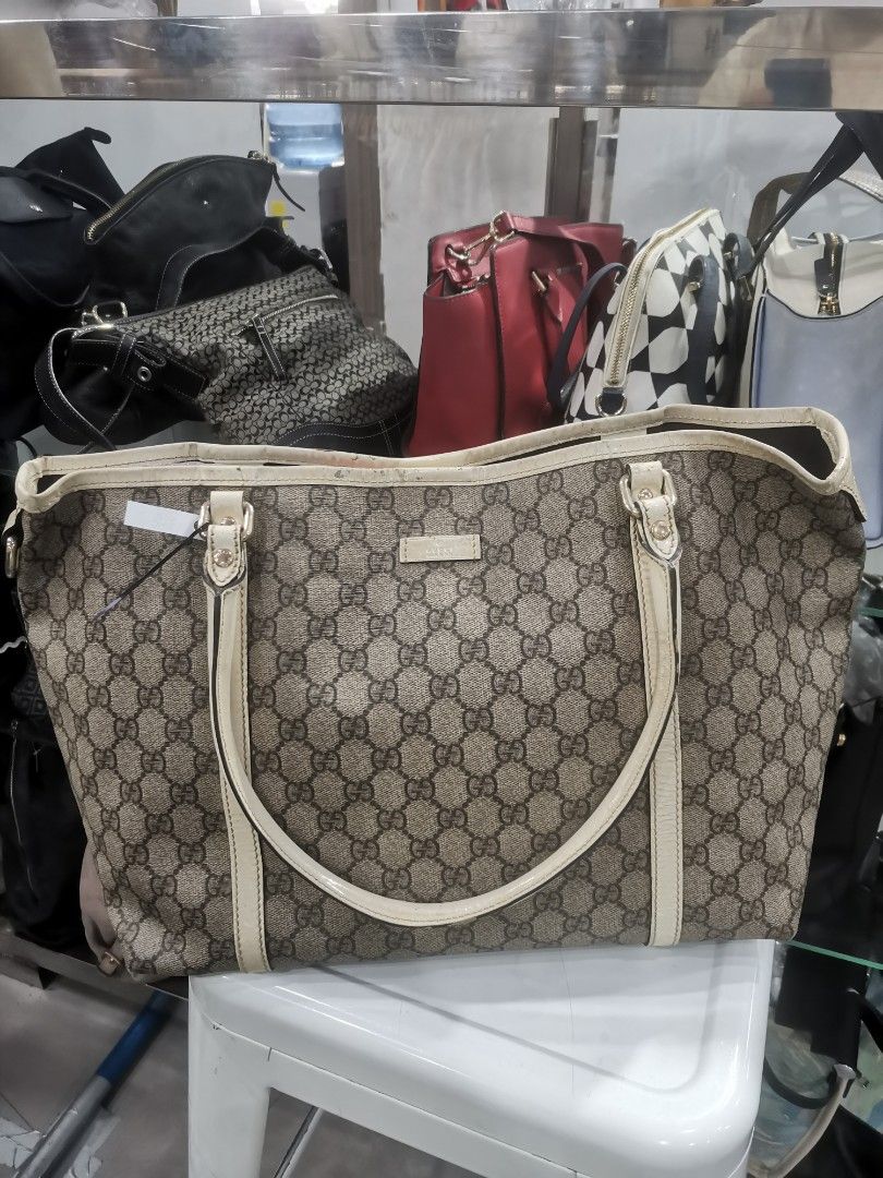 Gucci GG Monogram Tote Bag Beige/Cream (Category: Luxury Bags & Wallets) located in Manila. Submitted by mrpalkups666 (Listing ID 1444636618, Image 1). Description: - Gucci tote bag - Classic GG monogram canvas - Cream leather trim - Spacious interior, perfect for everyday or travel - Interior is clean - Serial number visible in photos - Made in Italy.