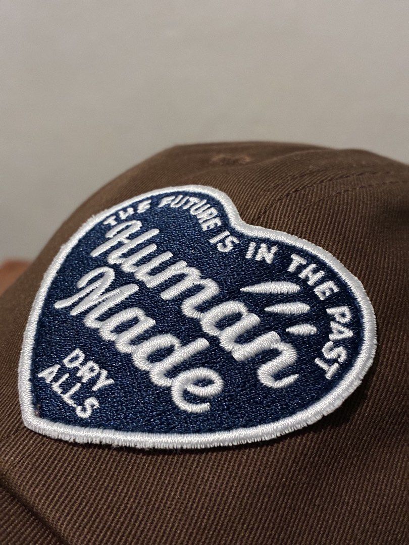 Human Made Heart Logo 6 Panel Twill Cap (Category: Caps & Hats) located in Tarlac. Submitted by ayla.shop (Listing ID 1444657685, Image 1). Description: Human Made 6 Panel Twill Cap Heart Logo Patch Brown Color ( Navy Heart Patch ) Brandnew & Authentic LBC or J&T Express.