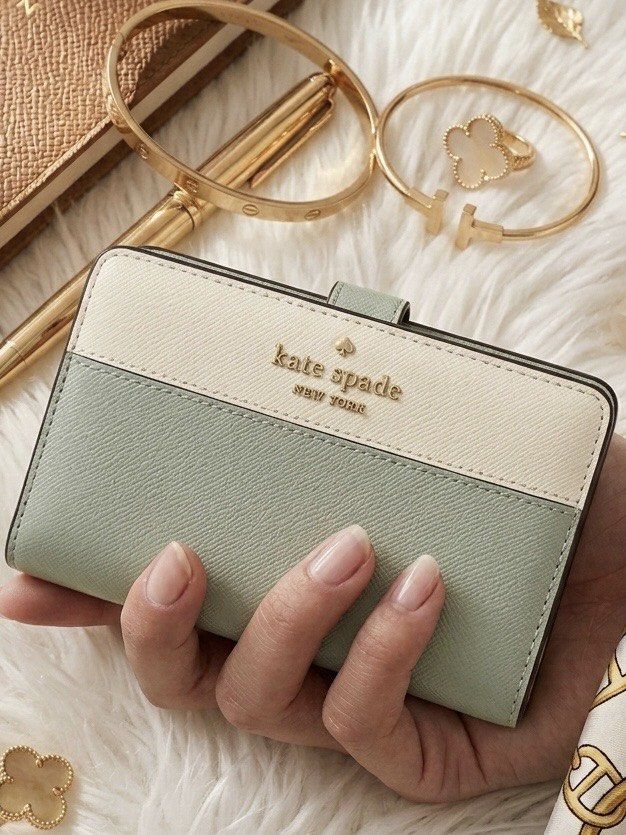 Kate Spade Leather Two Tone Bifold Wallet - Madison (Category: Wallets & Card holders) located in Quezon City. Submitted by mnl.drops (Listing ID 1421895516, Image 3). Description: ✨ Keep your essentials neatly organized in style! ✨ Looking for a compact wallet that packs a major organizational punch? This chic accessory holds all your cards, cash, and coins while keeping your look effortlessly polished. 📋 Product Details: Color: Sage Material: 