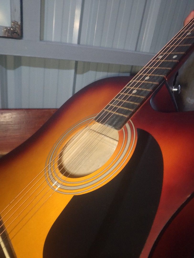 KAWES Acoustic Guitar Sunburst (Category: Musical Instruments) located in Manila. Submitted by godzilla5647 (Listing ID 1444614687, Image 3). Description: - KAWES Acoustic Guitar - Beautiful Sunburst finish on the front - Dark wood back and neck - Standard 6-string configuration - Comfortable cutaway body style - Ideal for beginners or as a secondary guitar - Tuners conveniently located on the headstock - Made in China.