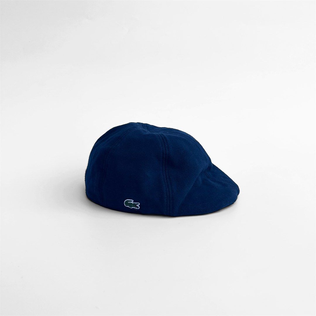 LACOSTE Dark blue Beret Flat hat (Category: Caps & Hats) located in Lemery. Submitted by thesecond_row.ph (Listing ID 1444507102, Image 1). Description: LACOSTE Dark blue Beret Flat hat Size: Small-Medium Condition: Excellent Color rate: 9.5/10 Issue(s): none .