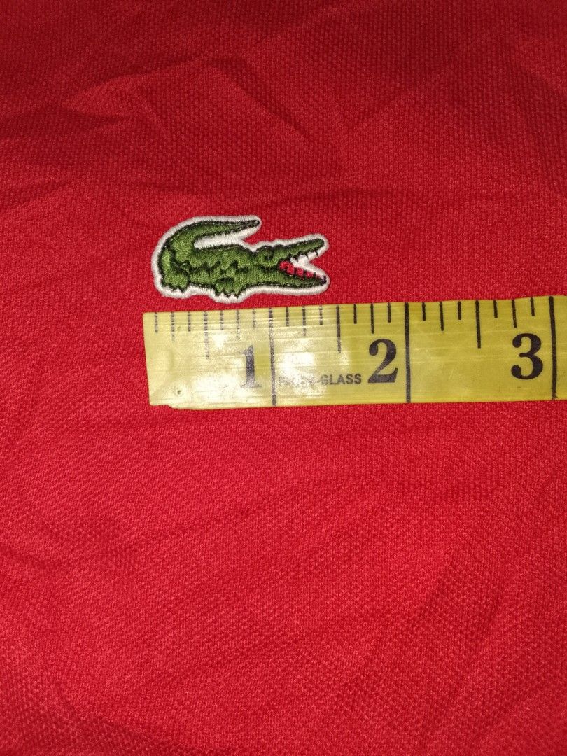 Lacoste Polo Shirt Red Size 3 (Category: Tshirts & Polo Shirts ) located in Zamboanga. Submitted by zhumhazhav (Listing ID 1444516578, Image 3). Description: - A classical red lacoste polo shirt - An iconic crocodile logo on chest - Comfortable pique cotton fabric - Versatile for casual or sporty looks - Pair with jeans or shorts - Size 3 on tag - Dimes 18x25.5-26 - Condition excellent - Color rate 9.8/10 - See all photos for details 850+shipping