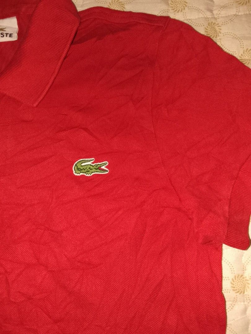 Lacoste Polo Shirt Red Size 3 (Category: Tshirts & Polo Shirts ) located in Zamboanga. Submitted by zhumhazhav (Listing ID 1444516578, Image 2). Description: - A classical red lacoste polo shirt - An iconic crocodile logo on chest - Comfortable pique cotton fabric - Versatile for casual or sporty looks - Pair with jeans or shorts - Size 3 on tag - Dimes 18x25.5-26 - Condition excellent - Color rate 9.8/10 - See all photos for details 850+shipping