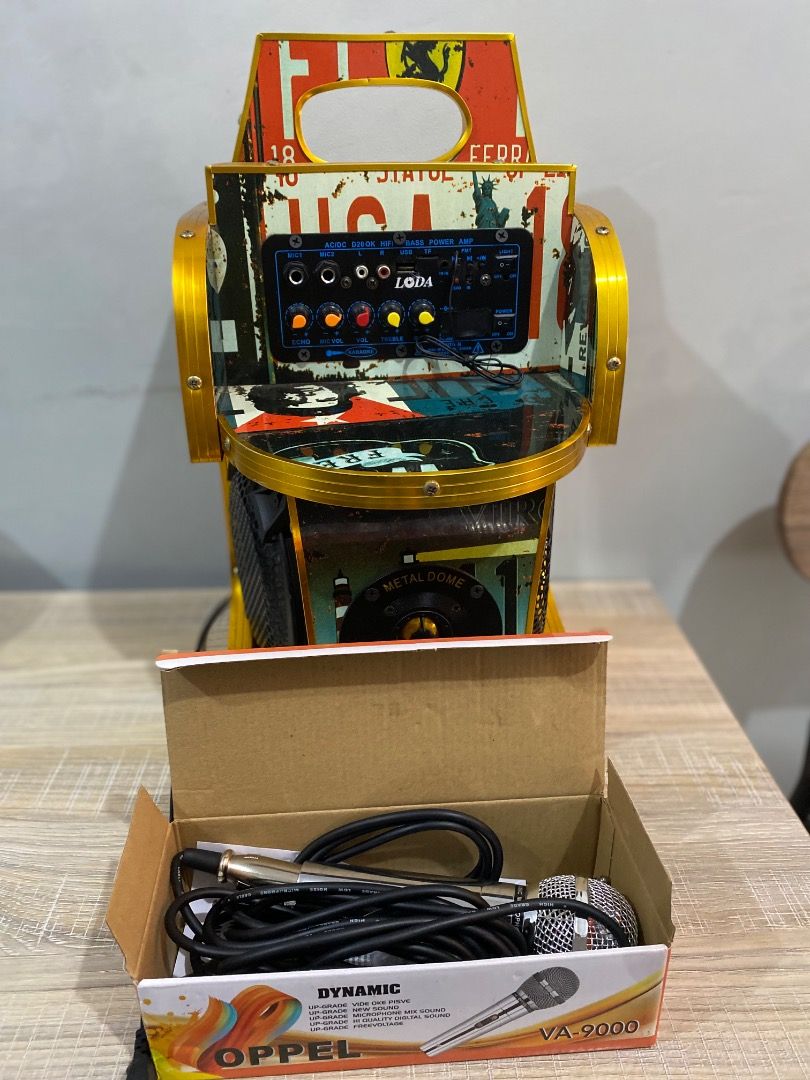 LODA Karaoke Machine with OPPEL Microphones (Category: Soundbars, Speakers & Amplifiers) located in Caloocan City. Submitted by purepenguin.097493 (Listing ID 1444677734, Image 2). Description: - Unique, custom-decorated karaoke machine - Features LODA amplifier - Includes two OPPEL VA-9000 dynamic microphones - Eye-catching vintage license plate theme design - All necessary cables included - Ready for parties and singing sessions!.