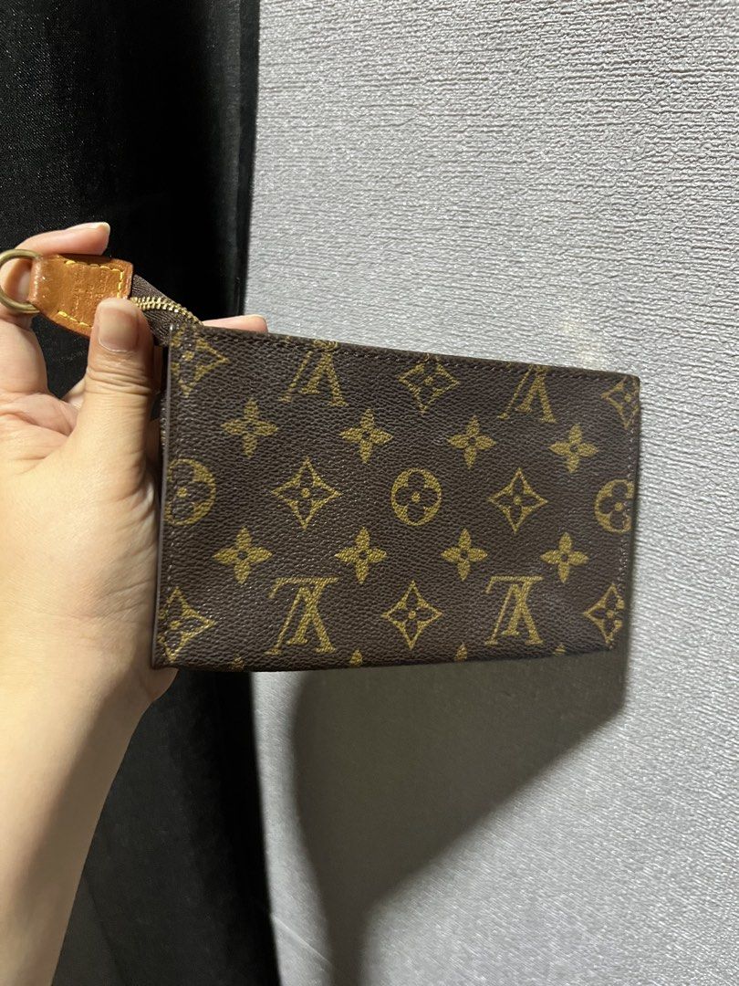 Louis Vuitton Monogram Canvas Pouch (Category: Luxury Bags & Wallets) located in Paranaque City. Submitted by sctmpque (Listing ID 1444557448, Image 1). Description: - Authentic Louis Vuitton monogram canvas pouch - Classic LV print - Zipper closure - Small size, ideal for cards or coins - Features a leather tab and gold hardware -Fits iPhone promax.