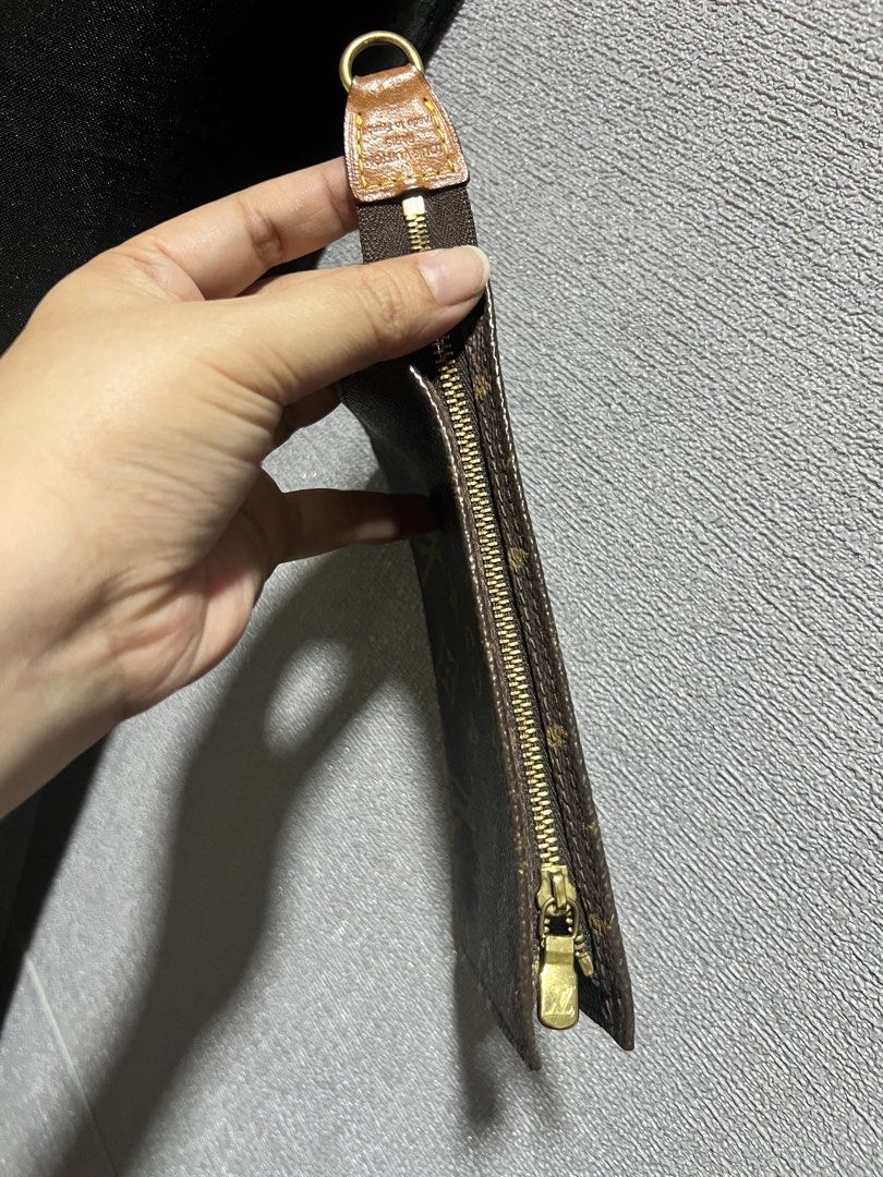 Louis Vuitton Monogram Canvas Pouch (Category: Luxury Bags & Wallets) located in Paranaque City. Submitted by sctmpque (Listing ID 1444557448, Image 3). Description: - Authentic Louis Vuitton monogram canvas pouch - Classic LV print - Zipper closure - Small size, ideal for cards or coins - Features a leather tab and gold hardware -Fits iPhone promax.