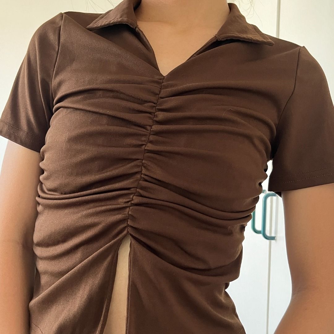 Lovito Plain Ruched Split Front Top Brown Collared Short Sleeve Crop (Category: Blouses) located in Santa Rosa. Submitted by declutterbyfena (Listing ID 1444567378, Image 3). Description: srp: 285 selling: 160 loc: santa rosa, laguna - bought from orange app (Lovito) - polyester fabric - fits small - Ruched detailing down the front.