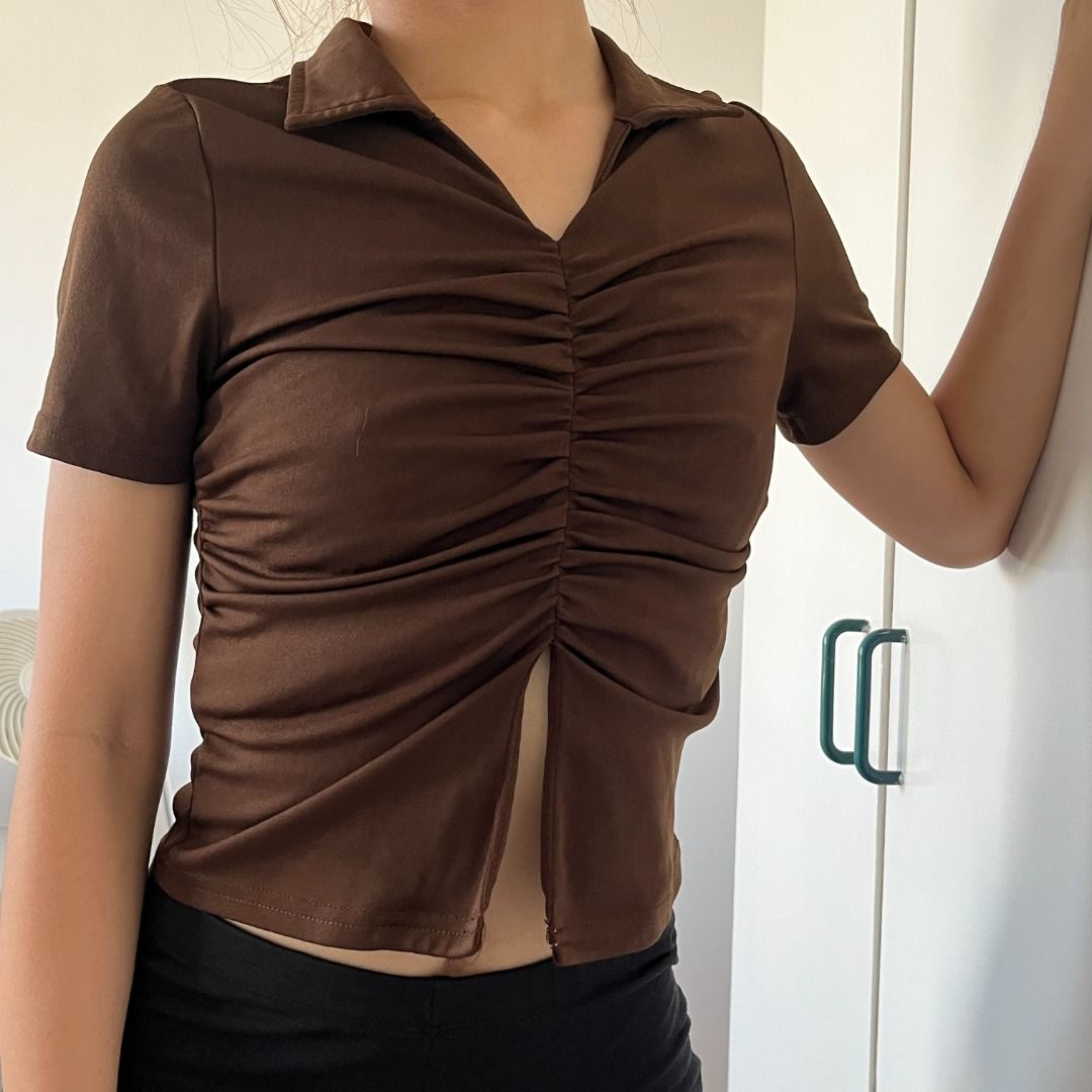Lovito Plain Ruched Split Front Top Brown Collared Short Sleeve Crop (Category: Blouses) located in Santa Rosa. Submitted by declutterbyfena (Listing ID 1444567378, Image 2). Description: srp: 285 selling: 160 loc: santa rosa, laguna - bought from orange app (Lovito) - polyester fabric - fits small - Ruched detailing down the front.