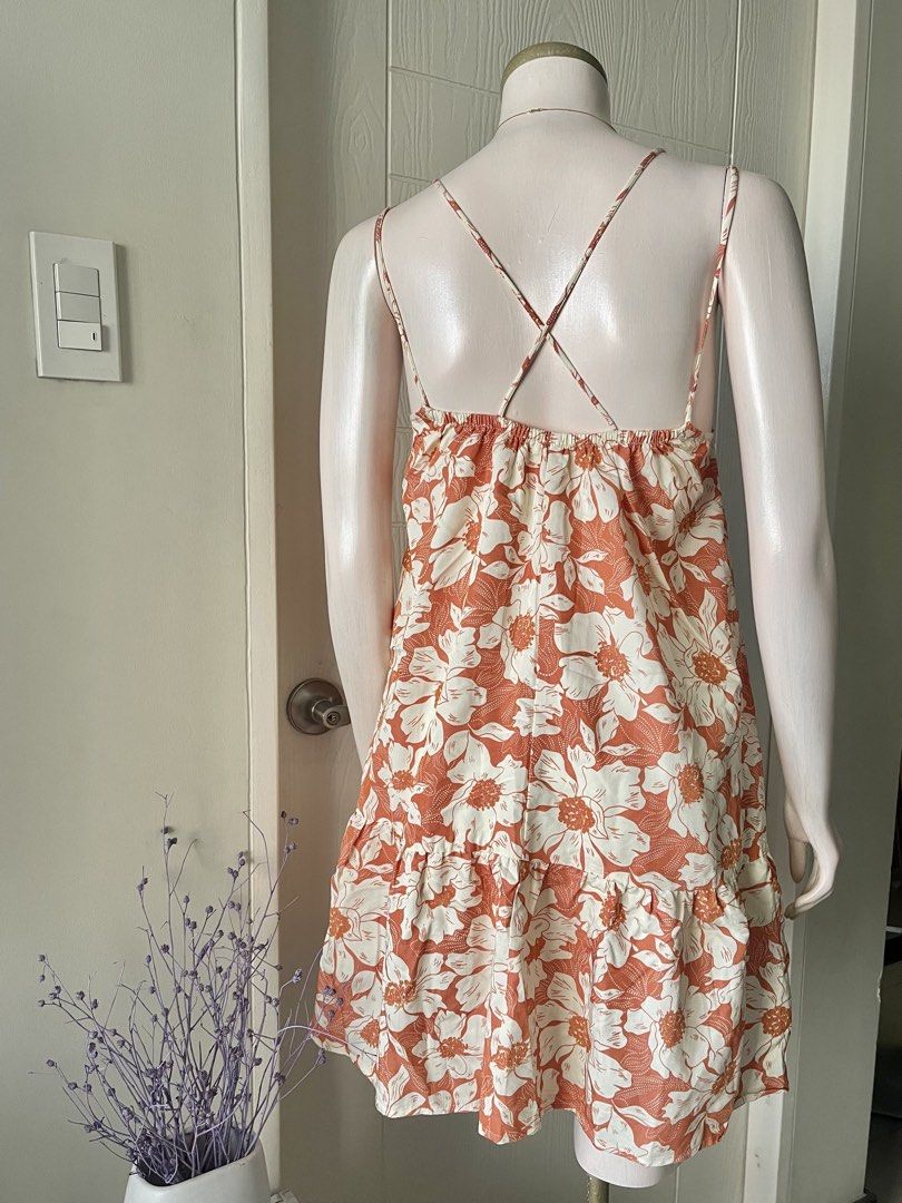 MANGO Mini Dress with Criss-Cross Back Straps (Category: Dresses) located in Mandaluyong City. Submitted by iamprettywow (Listing ID 1444567276, Image 3). Description: - Actual Photo posted -What you see is What you get - XS in size but fit up to medium 38 bust Mannequin size is Small 5’4 height - Adorable orange and white floral print mini dress - Features delicate spaghetti straps with a stylish criss-cross back detail - Flattering tiered hemli