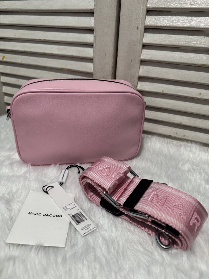 Marc Jacobs Pink Leather Camera Bag with Strap (Category: Luxury Bags & Wallets) located in Quezon City. Submitted by mrsp_28 (Listing ID 1444529774, Image 2). Description: - Authentic Marc Jacobs pink leather camera bag - Like brand new with original tags attached - Comes with the original strap - Features signature Marc Jacobs logo on the front - Secure zipper closure - Ideal for everyday use MOP: BPI/Gcash/ Maribank.