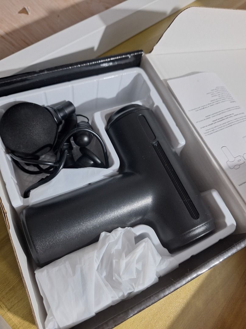 Massage Gun - Black (Category: Massage Devices) located in Quezon City. Submitted by camille_cr (Listing ID 1444643920, Image 1). Description: Orig price: 710.00 Rfs: Di nagagamit; tambak lang - Black massage gun - Comes in original packaging - Includes foam head attachment - Ideal for muscle recovery and relaxation - Easy to hold and operate.