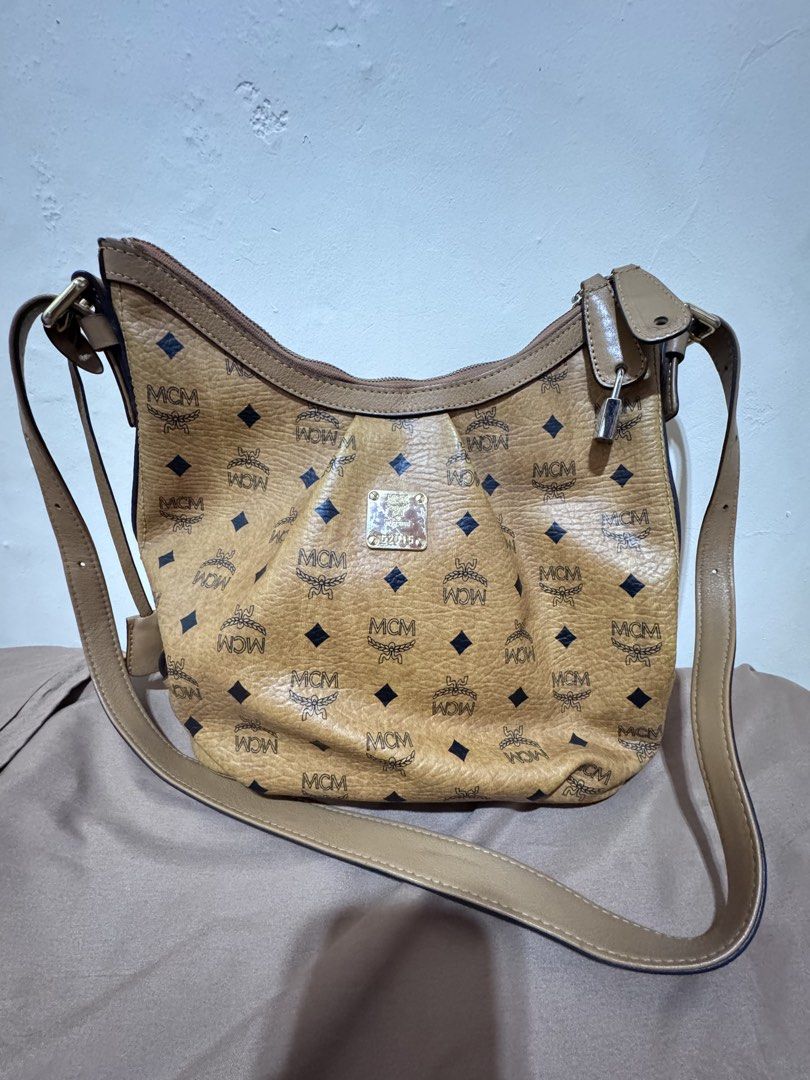 MCM Monogram Hobo Sling Bag (Category: Luxury Bags & Wallets) located in Angono. Submitted by rainnefer15849 (Listing ID 1444514687, Image 1). Description: Thrifted from Book Off Japan - Classic MCM cognac monogram hobo bag - Slightly negotiable - As is where is RFS: Decluttering Location: Rizal.