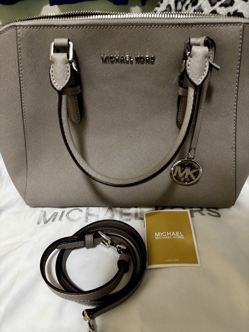 Michael Kors Grey Leather Satchel Handbag - Large (Category: Shoulder Bags) located in Las Pinas. Submitted by cire09. (Listing ID 1444518456, Image 2). Description: Authentic Grey Michael Kors Satchel Bought in US Comes with Dust Bag, Strap, and Care Card Never been used.